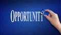 Opportunity word on Jigsaw puzzle. Man hand holding a blue puzzle to complete the word Opportunity divided over them conceptual o Royalty Free Stock Photo